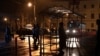 UKRAINE - People wait at a tram stop during a blackout in Kyiv, Ukraine, Sunday, Nov. 6, 2022