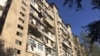 AZERBAIJAN -- report SEPTEMBER 2017 The Origin of the Money - Reporters visited the building where Baktelekom is registered and found only an ordinary-looking Baku apartment building. Credit: OCCRP 