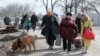 Refugees leave the besieged city of Mariupol